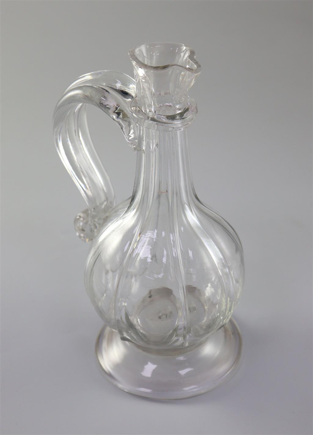 A Georgian rib moulded glass cordial jug, first half 18th century, 20.5cm high